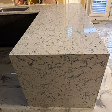 Quartz waterfall island countertop installed by Sunsai
